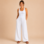 Front view of the Cleo Lightweight Linen Wide-Leg Summer Pants in white, featuring a relaxed wide-leg silhouette and breathable linen fabric. Designed by Bella Hudson.