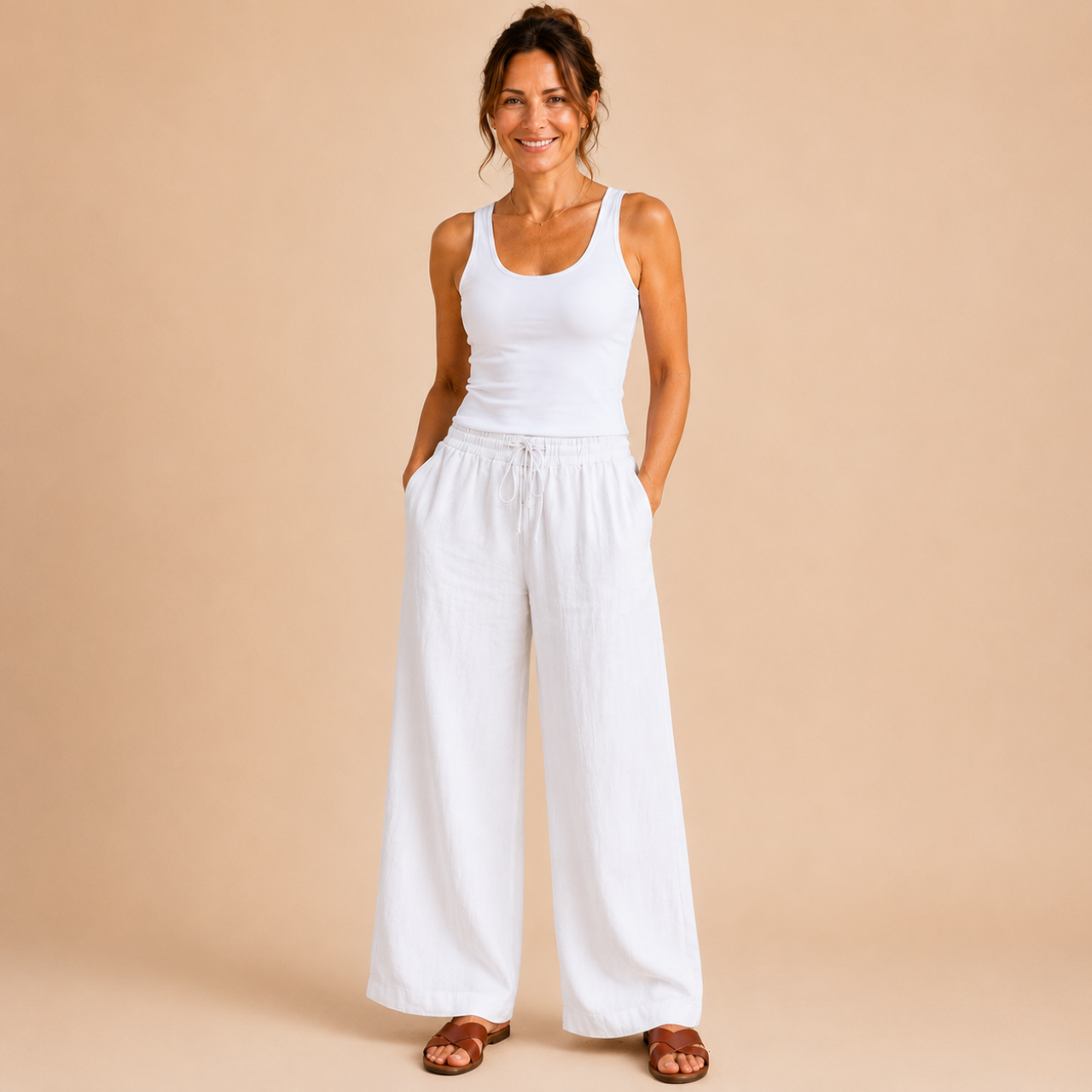 Front view of the Cleo Lightweight Linen Wide-Leg Summer Pants in white, featuring a relaxed wide-leg silhouette and breathable linen fabric. Designed by Bella Hudson.