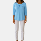 Full front view of the Colette Bow-Tie Long Sleeve T-shirt in blue, showcasing the bow neckline, ribbed texture, three-quarter sleeves, and relaxed everyday silhouette. Designed by Bella Hudson.