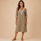 Front view of the Cora Midi Dress Lightweight Linen V-Neck Summer in khaki, featuring a relaxed linen silhouette, crochet V-neck detail, and elegant three-quarter sleeves. Designed by Bella Hudson.