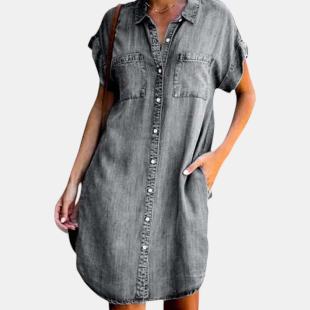 Front view of the Corinne Shirt Dress Chambray Denim Button-Front in gray, featuring a collared neckline, button-front closure, chest pockets, and a relaxed shirt dress silhouette. Designed by Bella Hudson.