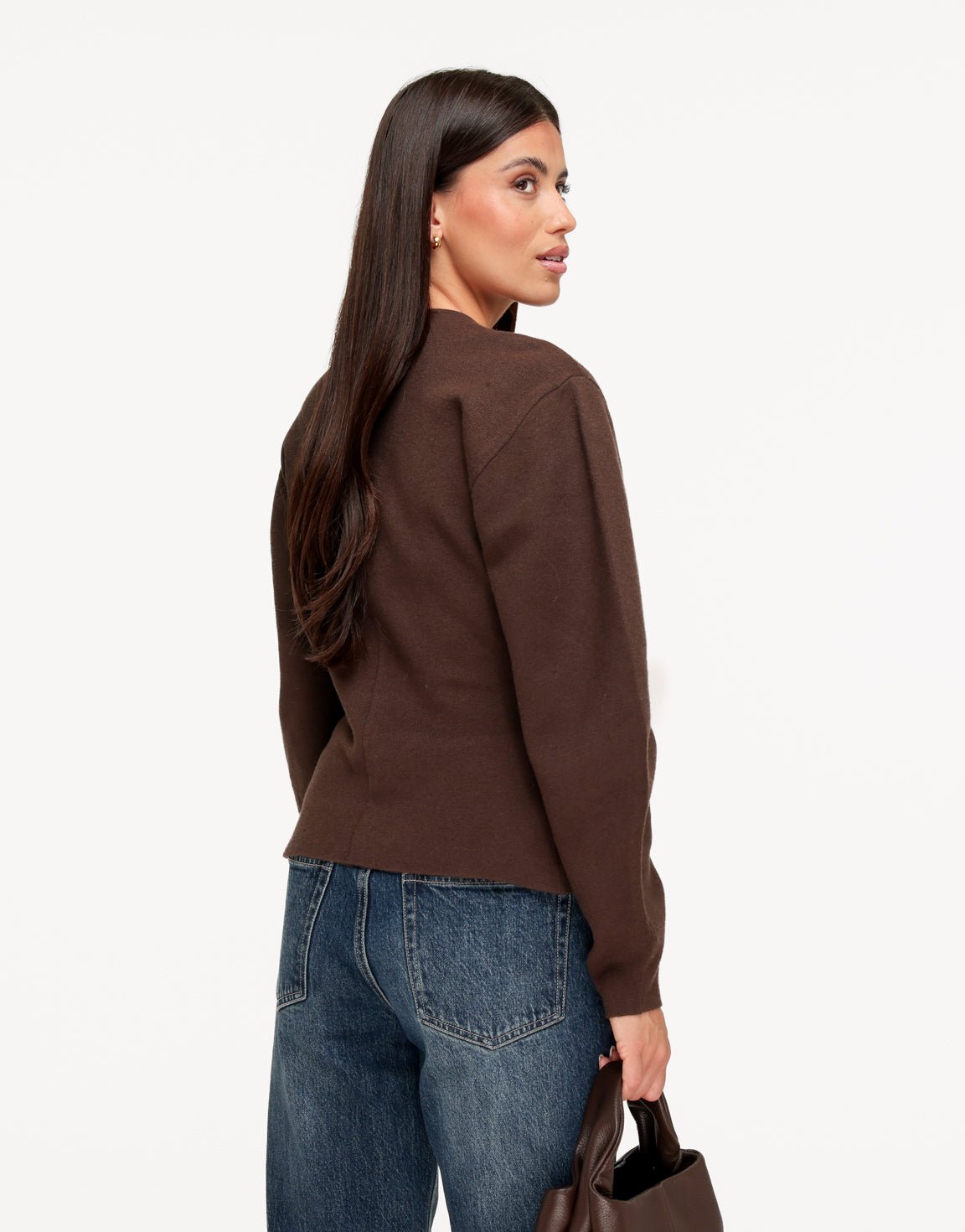 Dahlia Dark Brown cardigan shown from the back three-quarter angle, with a shaped back seam and balloon sleeves.