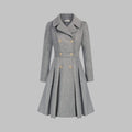 Dahlia Gray A-line coat featuring notched lapels, double-breasted buttons, a defined waist, long sleeves, and a pleated flared hem