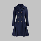 Dahlia Navy Blue tailored coat featuring notched lapels, double-breasted button detailing, long sleeves, and a flared pleated hem