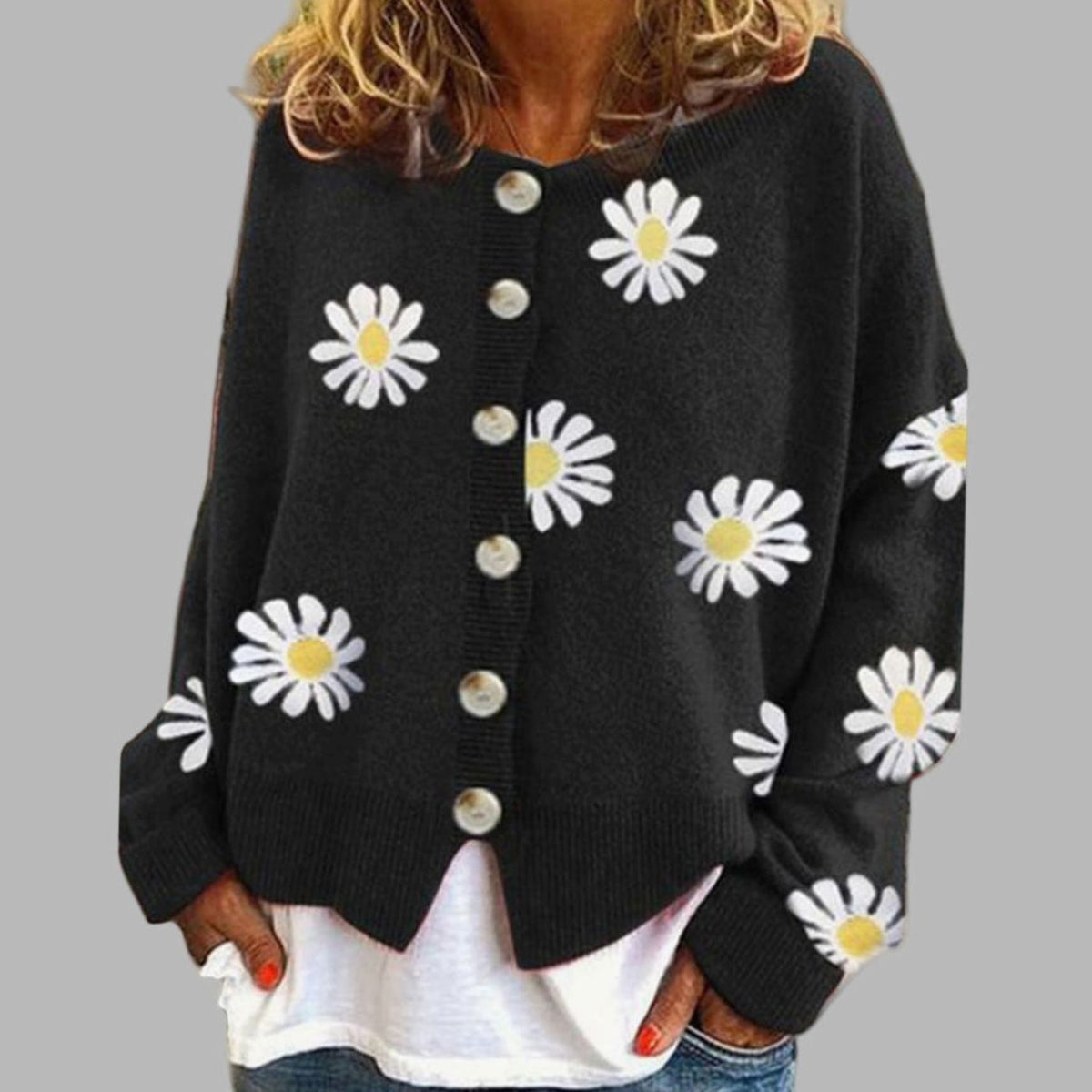 Daisy Black button-front cardigan featuring a daisy floral pattern, round neckline, long sleeves, ribbed cuffs, and relaxed silhouette
