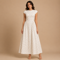 Darcy Polka Dot Maxi Dress with round neckline and A-line silhouette front view. Designed by Bella Hudson.