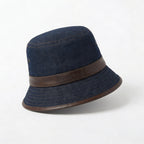 Dark blue denim bucket hat with leather band angled side view BELLA HUDSON