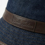Close up of dark blue denim bucket hat leather band logo detail BELLA HUDSON