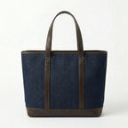 Back view of dark blue denim tote bag with leather handles BELLA HUDSON