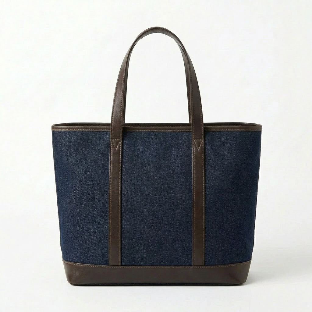 Back view of dark blue denim tote bag with leather handles BELLA HUDSON