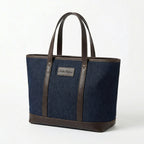 Dark blue denim tote bag with brown leather handles front view BELLA HUDSON