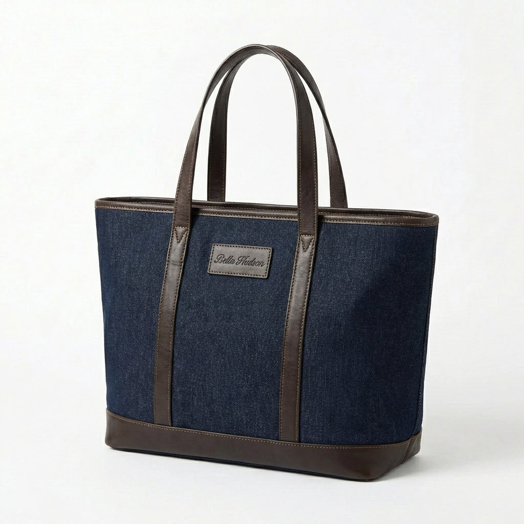 Dark blue denim tote bag with brown leather handles front view BELLA HUDSON