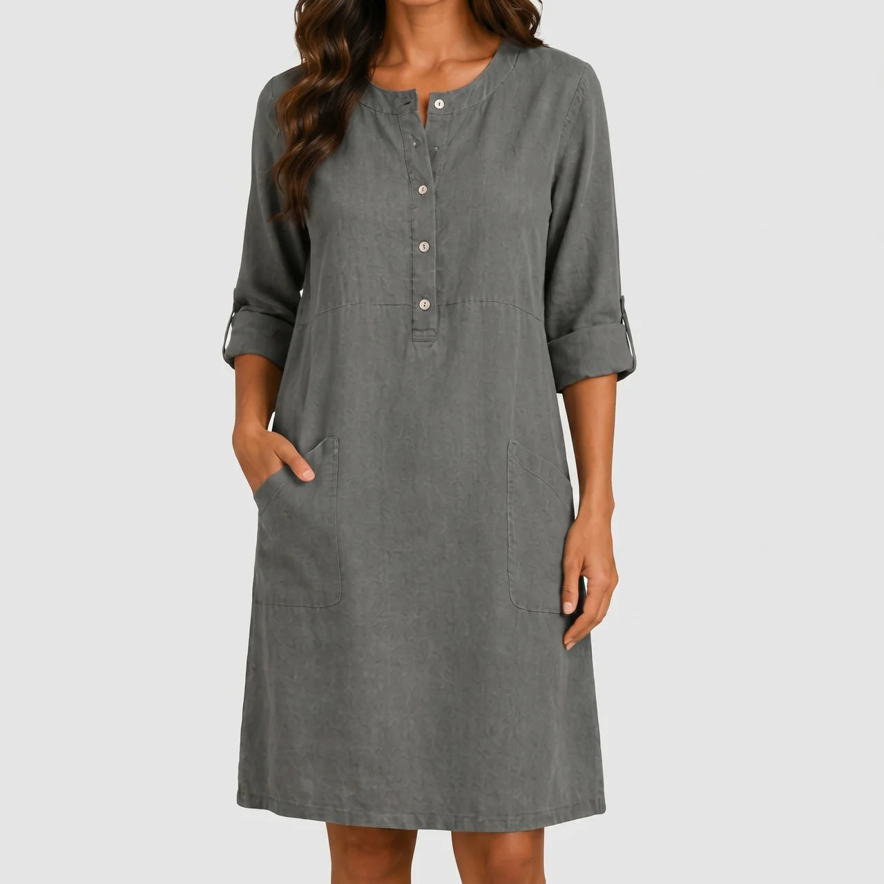 Front view of dark gray linen midi dress with rolled sleeves and side pockets by BELLA HUDSON