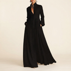 Front view of the Delphine Maxi Dress Linen Button-Front Long-Sleeve in Black, featuring a classic button-front design, long sleeves, and a flowing maxi silhouette. Designed by Bella Hudson.