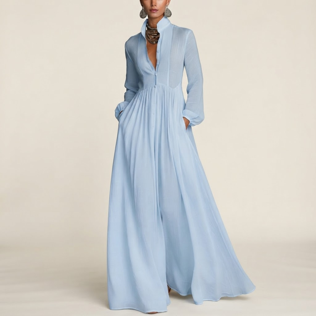 Front view of the Delphine Maxi Dress Linen Button-Front Long-Sleeve in Blue, featuring a classic button-front design, long sleeves, and a flowing maxi silhouette. Designed by Bella Hudson.