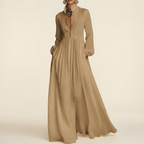 Front view of the Delphine Maxi Dress Linen Button-Front Long-Sleeve in Brown, featuring a classic button-front design, long sleeves, and a flowing maxi silhouette. Designed by Bella Hudson.