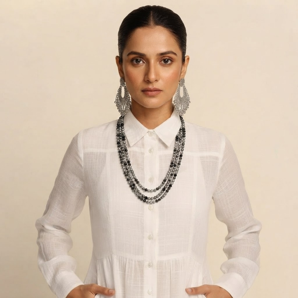Close-up front view of the Delphine Maxi Dress Linen Button-Front Long-Sleeve in White, showcasing the button-front detailing, long sleeves, and elegant neckline. Designed by Bella Hudson.