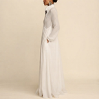 Side view of the Delphine Maxi Dress Linen Button-Front Long-Sleeve in White, showcasing the elegant long sleeves and flowing maxi silhouette. Designed by Bella Hudson.