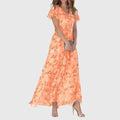 Front view of the Delphine Summer Maxi Dress Floral Print Flutter Sleeve in orange, featuring a V-neckline, flutter sleeves, floral print, tiered maxi skirt, and a flowing feminine silhouette. Designed by Bella Hudson.
