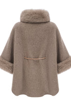 Elara Brown faux-fur trim cape coat shown from the back with a relaxed draped silhouette and faux-fur trimmed sleeves