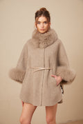 Elara Brown faux-fur trim cape coat featuring a plush collar, wide sleeves, self-tie belt, and side pockets