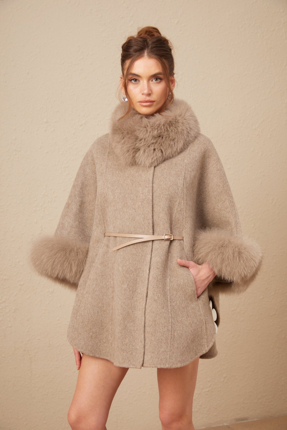 Elara Brown faux-fur trim cape coat featuring a plush collar, wide sleeves, self-tie belt, and side pockets