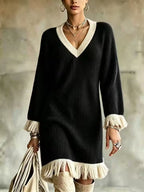 Elena Black ribbed knit sweater dress with contrasting V-neck trim, fringe cuffs, and relaxed silhouette