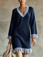 Elena Navy Blue ribbed knit sweater dress with contrasting V-neck trim, long sleeves, and fringed hem