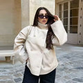Elena White double-breasted short coat with high stand collar, relaxed long sleeves, button-front styling, and hip-length silhouette