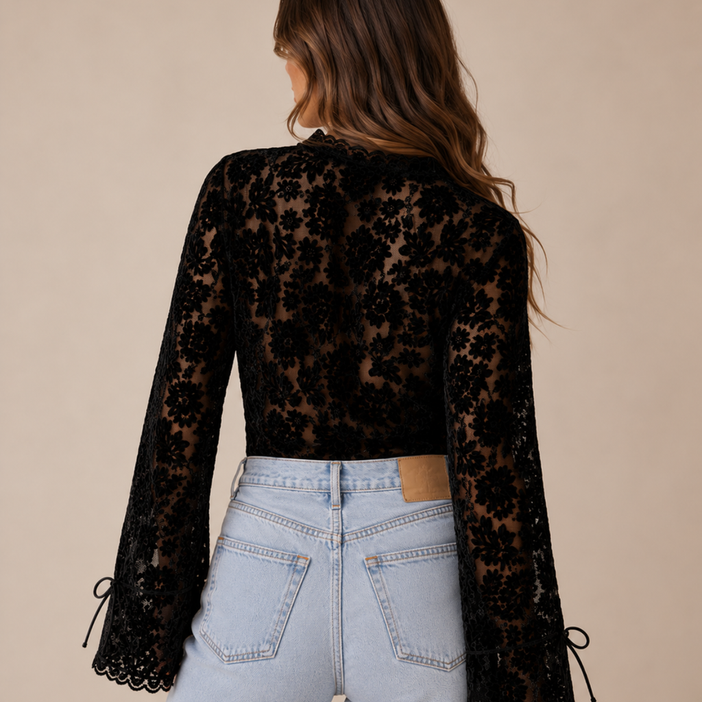 Back view of Elia Floral Lace Long Sleeve Blouse in Black featuring intricate floral lace detailing and a lightweight silhouette designed by Bella Hudson.