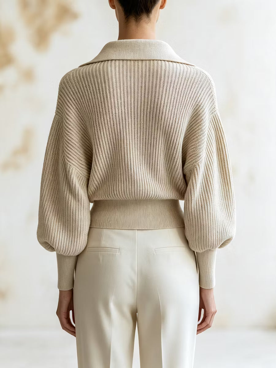 Elise Beige ribbed knit sweater from the back, showing the collar, balloon sleeves, and ribbed cuffs and hem.