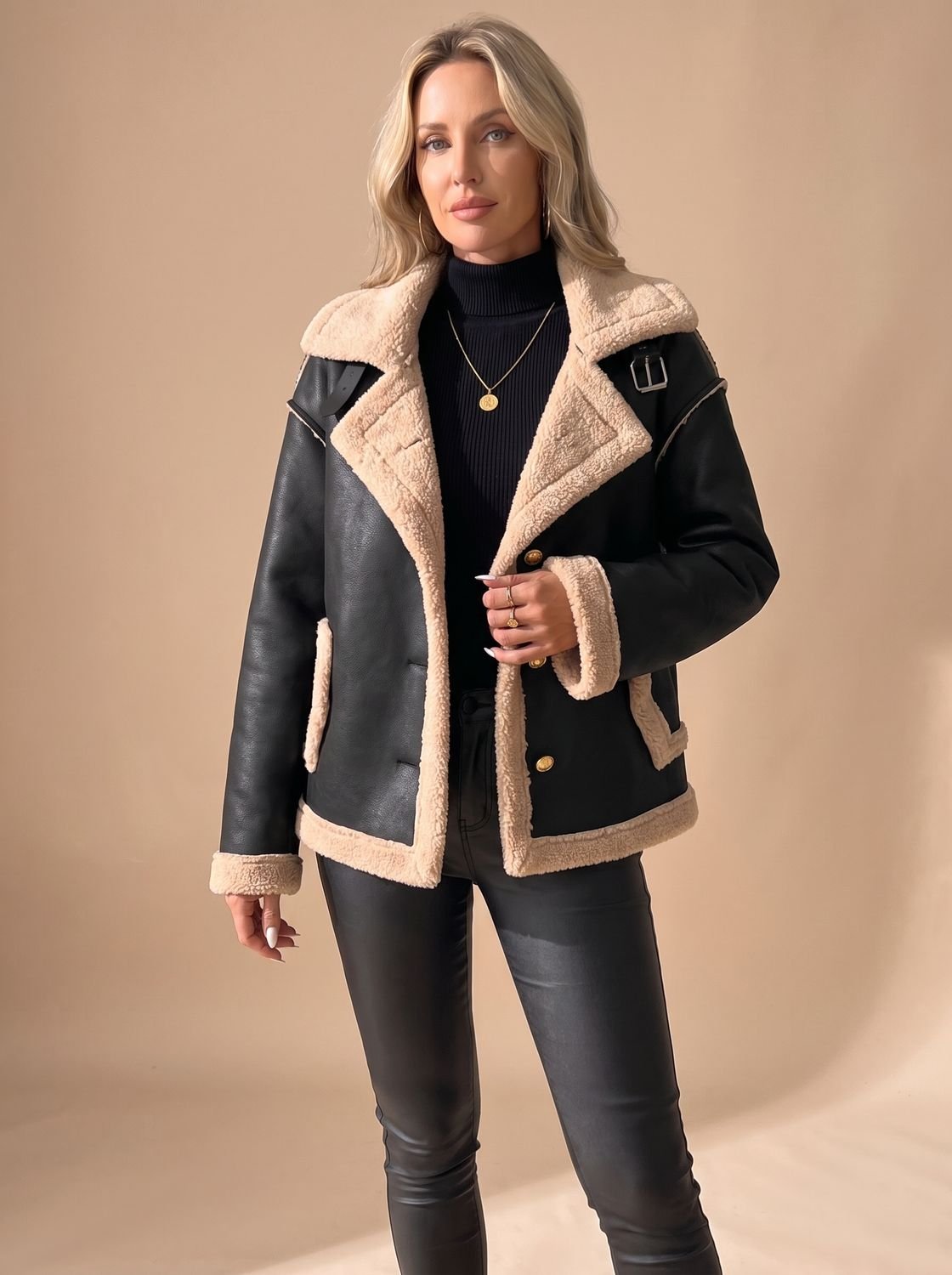 Elise Black faux leather sherpa-trim jacket featuring contrast trim, wide collar, button-front design, long sleeves, and patch pockets
