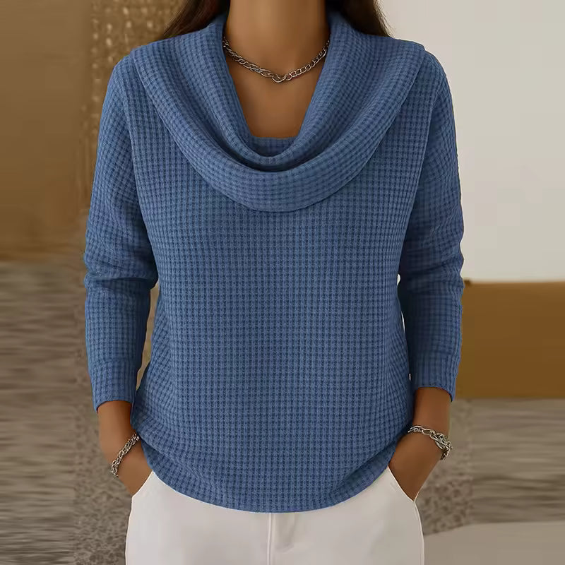 Elise Blue waffle-knit sweater with draped cowl neckline, long sleeves, relaxed fit, and curved hem