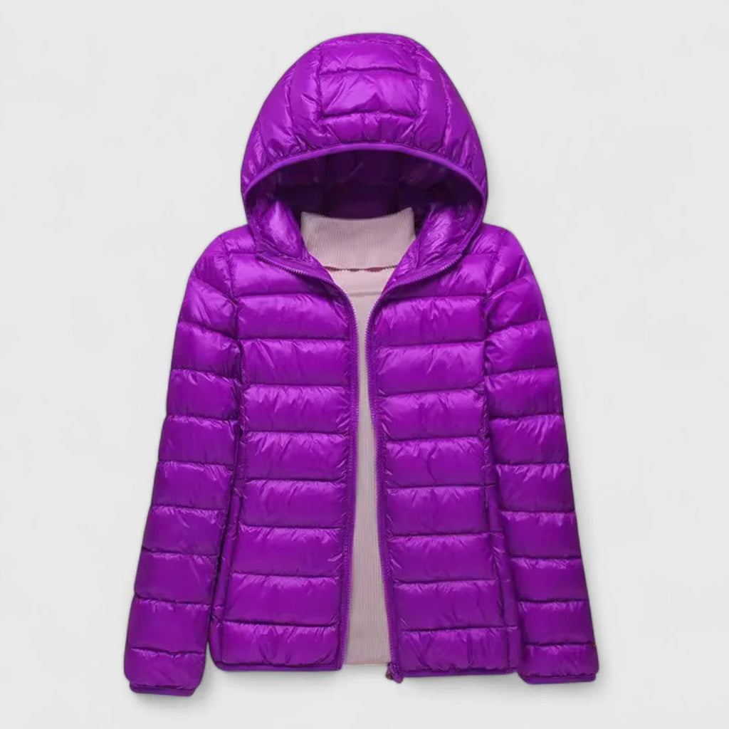 Elise Purple lightweight puffer jacket featuring a quilted exterior, attached hood, full front zipper, and long sleeves