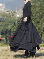 Elodie Black corduroy maxi skirt with high waist, asymmetric tiers, and flowing silhouette