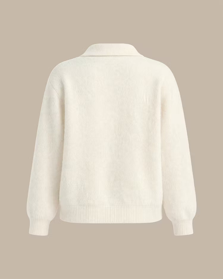 Elowen Apricot cardigan laid flat from the back, showing the collar, relaxed shape, and ribbed hem.