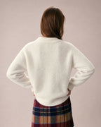 Elowen Apricot cardigan shown from the back, with a soft knit finish, ribbed hem, and relaxed sleeves.