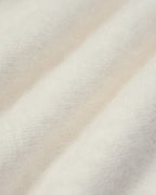 Elowen Apricot close-up of the soft, fuzzy knit texture.