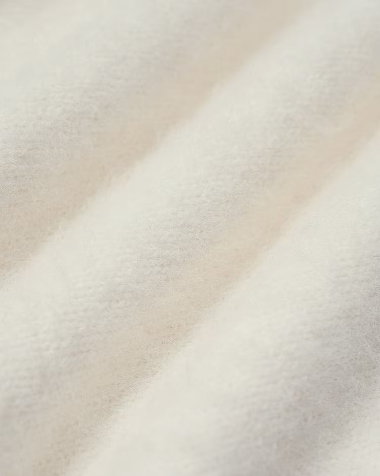 Elowen Apricot close-up of the soft, fuzzy knit texture.