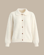 Elowen Apricot collared cardigan laid flat from the front, showing the rounded collar, brown buttons, and ribbed cuffs and hem.