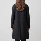Back view of the Emilia Trench Coat Midi Double-Breasted in black, featuring a clean structured back, long sleeves, and a straight midi-length silhouette. Designed by Bella Hudson.