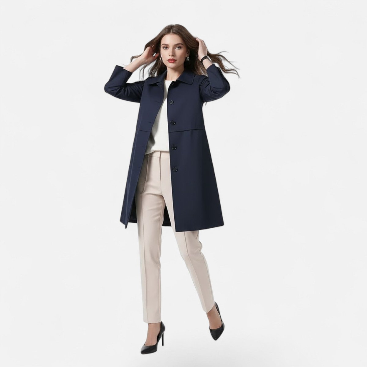 Open front view of the Emilia Trench Coat Midi Double-Breasted in navy blue, featuring a pointed collar, long sleeves, double-breasted construction, and a straight midi-length silhouette. Designed by Bella Hudson.