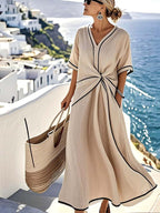 Front view of beige Emma Light Blue Maxi Dress with Elegant Twist-waist by BELLA HUDSON