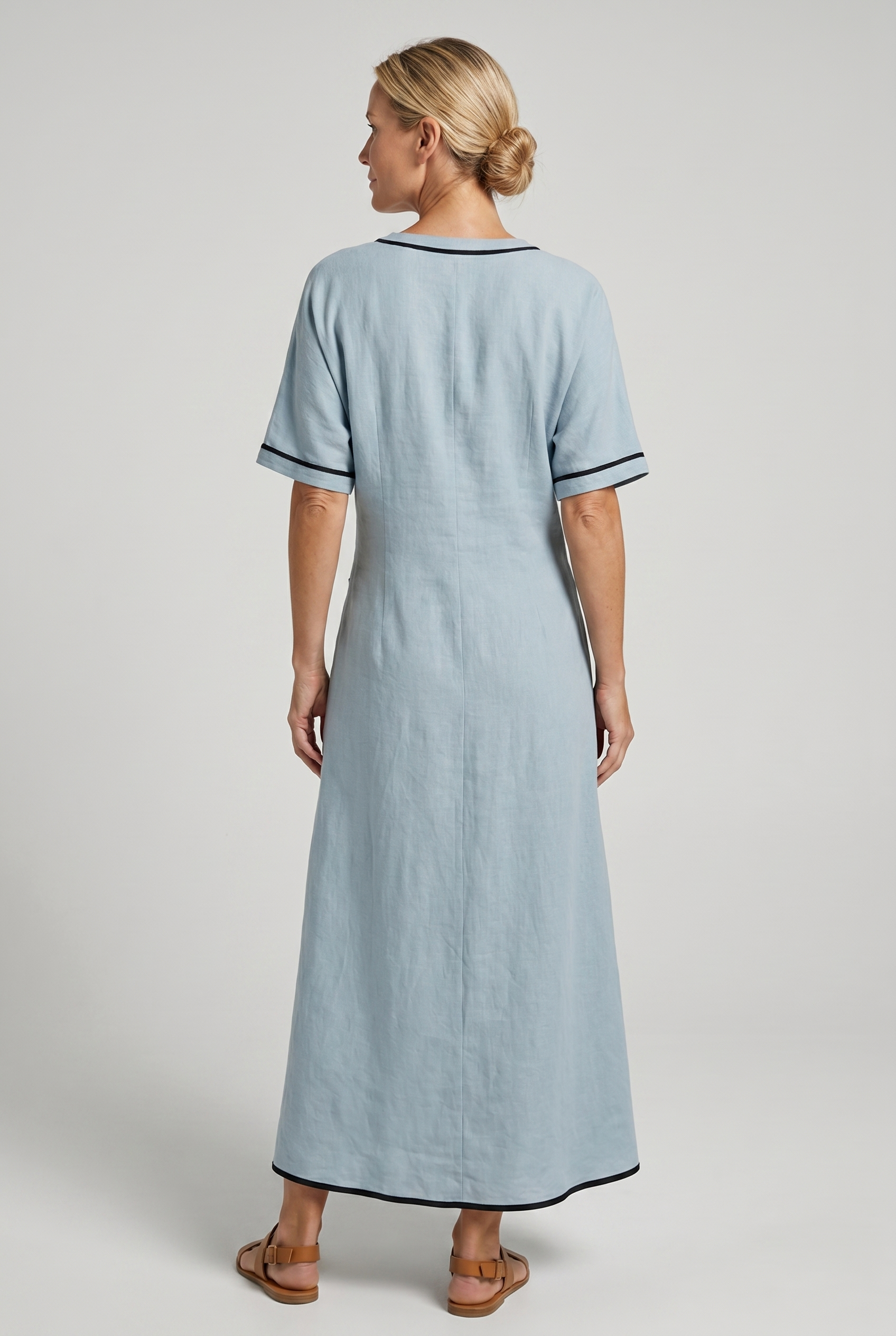 Back view of blue Emma Light Blue Maxi Dress with Elegant Twist-waist by BELLA HUDSON
