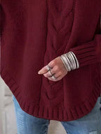 Esme cable-knit pullover sweater with oversized silhouette, braided front detail, and ribbed cuffs