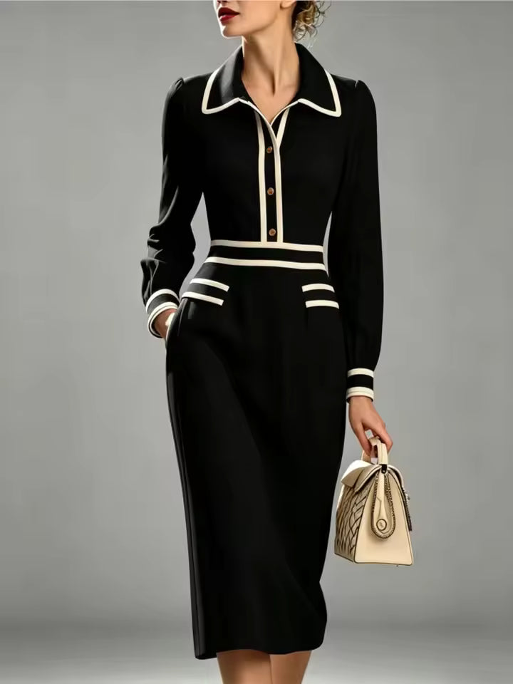 Evelyn Black long-sleeve midi dress with contrast-trimmed collar, defined waist, and decorative pocket flaps