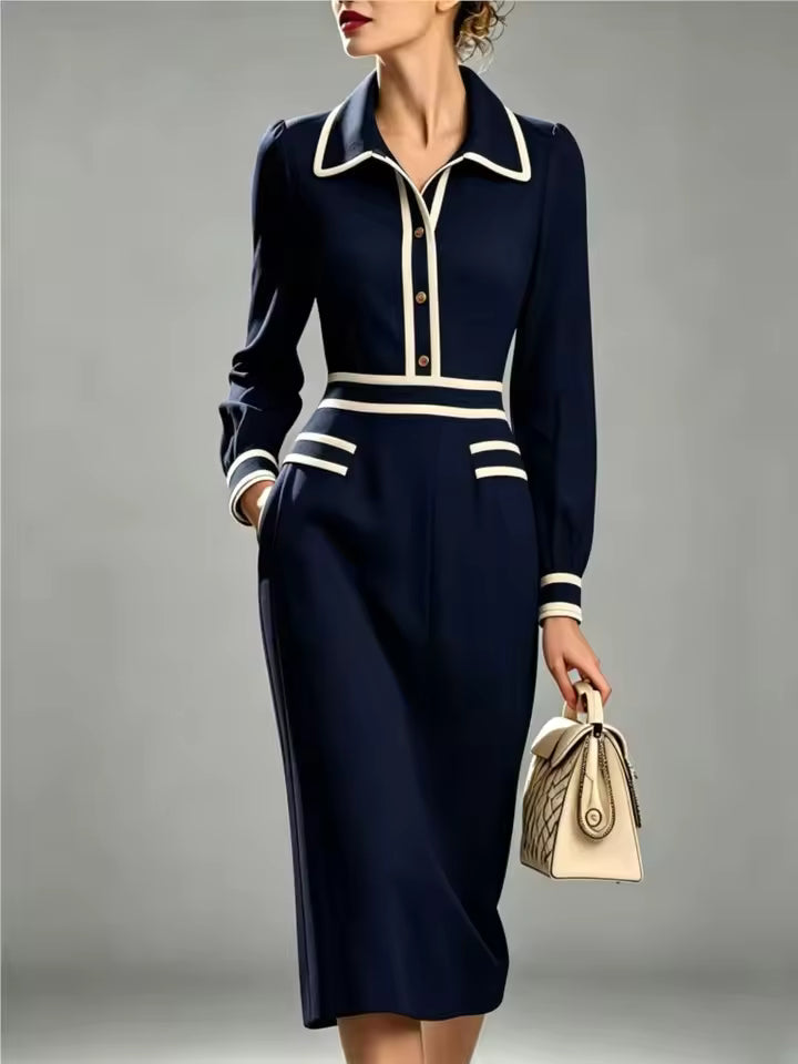 Evelyn Navy midi dress with pointed collar, contrast trim, fitted silhouette, and long sleeves