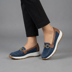 Farrah Grey Suede Sneaker Loafers with Gold Buckle shown in front view, featuring a slip-on design, cushioned sole, and lightweight sneaker-inspired outsole.