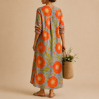 Faye Lightweight Layered Linen Midi Dress, back view featuring the flowing layered silhouette and relaxed everyday style. Designed by Bella Hudson.