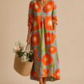 Close-up of the Faye Lightweight Layered Linen Midi Dress showcasing the soft lightweight linen fabric, layered construction, and elegant detailing. Designed by Bella Hudson.